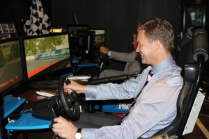 Sture Myrmell - Carnival Australia vice president hotel operations takes on Carnival Australia entertainment manager David Druery on the new V8 simulators onboard Pacific Pearl. Photo Credit: Carnival Australia