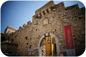 The stone archway signalling the entrance to the traffic-free streets of Taormina 